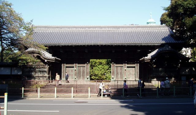 A big black and old fashioned gate in Ueno Park. Front Gate of Feudal Lord, Ikeda Family